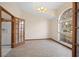 A well-lit formal dining room featuring tile floors and a decorative window at 11160 Sylvan Pond Cir, Orlando, FL 32825