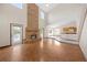 Bright open-concept living space featuring hardwood floors and brick fireplace at 11160 Sylvan Pond Cir, Orlando, FL 32825