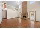 Spacious living room with hardwood floors, high ceilings and a brick fireplace at 11160 Sylvan Pond Cir, Orlando, FL 32825