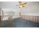 Open loft area with view of the living room and kitchen below at 11160 Sylvan Pond Cir, Orlando, FL 32825
