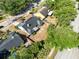 Aerial view of the home with fenced yard and a street with mature shade trees at 1134 Shaffer Trl, Oviedo, FL 32765