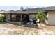 The backyard includes a screened-in porch and a small patio area, surrounded by minimal landscaping at 1134 Shaffer Trl, Oviedo, FL 32765