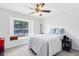 Cozy bedroom with a ceiling fan and window view of the outdoors at 1134 Shaffer Trl, Oviedo, FL 32765