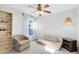 This room has an eclectic design with an armchair, shelving unit, and unique ceiling fan at 1134 Shaffer Trl, Oviedo, FL 32765