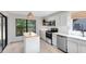 Modern kitchen with stainless steel appliances, white cabinets, and butcher block island at 1134 Shaffer Trl, Oviedo, FL 32765