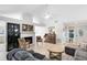 Bright living room with vaulted ceilings, fireplace, piano, and hardwood floors at 1134 Shaffer Trl, Oviedo, FL 32765