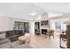 Spacious living room with a fireplace, vaulted ceilings, and sliding glass doors to patio at 1134 Shaffer Trl, Oviedo, FL 32765