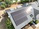 A close aerial view of a roof with installed solar panels at 1134 Shaffer Trl, Oviedo, FL 32765
