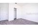Bright bedroom features neutral walls, carpet, and closet perfect for personalization at 1163 James Paul Rd, Davenport, FL 33837