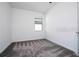 Bright bedroom with a window offers natural light and cozy carpet at 1163 James Paul Rd, Davenport, FL 33837