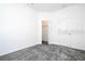 Bright bedroom features neutral walls, carpet, and closet perfect for personalization at 1163 James Paul Rd, Davenport, FL 33837
