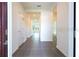 The foyer features tile floors, white walls, and a glimpse into other rooms at 1163 James Paul Rd, Davenport, FL 33837