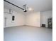 Spacious two-car garage with painted concrete flooring at 1163 James Paul Rd, Davenport, FL 33837