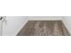 Gray carpeted hallway with white baseboards and white walls at 1163 James Paul Rd, Davenport, FL 33837