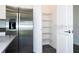 Contemporary kitchen featuring a refrigerator, a pantry, and sleek countertops at 1163 James Paul Rd, Davenport, FL 33837