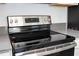 Elegant kitchen with stainless steel appliances and a modern cooktop range at 1163 James Paul Rd, Davenport, FL 33837