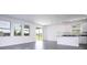 Bright living room featuring light walls, modern tile floors, and abundant natural light at 1163 James Paul Rd, Davenport, FL 33837