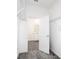 Spacious walk-in closet adjacent to the bathroom with metal shelving at 1163 James Paul Rd, Davenport, FL 33837
