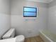 Bathroom with white tiled walls and a bathtub at 1249 12Th St, Clermont, FL 34711