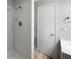 Bathroom featuring a shower with white tiles, a sink, and a towel rack at 1249 12Th St, Clermont, FL 34711