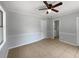 Spacious bedroom featuring neutral paint, tile flooring, and a modern ceiling fan at 1249 12Th St, Clermont, FL 34711