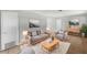 Cozy living room with hardwood floors, gray sofa and armchair, and a decorative coffee table at 1249 12Th St, Clermont, FL 34711