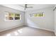 Sunlit bedroom with neutral carpet and ample natural light at 125 E Miller St, Orlando, FL 32806