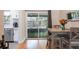 Cozy dining area right off of the kitchen with sliding doors leading to an enclosed patio at 125 E Miller St, Orlando, FL 32806