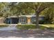 Charming single-story home with brick street and a bright yellow front door at 125 E Miller St, Orlando, FL 32806
