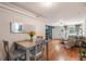 Inviting living space featuring hardwood floors, a dining area and bright natural light at 125 E Miller St, Orlando, FL 32806