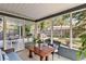 Relaxing sunroom with outdoor views, comfortable seating and room for entertaining at 125 E Miller St, Orlando, FL 32806