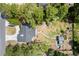 The property features a cozy backyard with a chicken coop, a fire pit, a tool shed, and a long driveway at 131 Autumn Ct, St Cloud, FL 34771