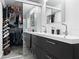 Bathroom featuring double vanity sinks and large mirror at 131 Autumn Ct, St Cloud, FL 34771