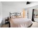 Bedroom features a bed with decorative headboard and ensuite bathroom at 131 Autumn Ct, St Cloud, FL 34771