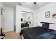Bedroom featuring a bed, mirrored closet, and ceiling fan at 131 Autumn Ct, St Cloud, FL 34771
