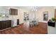 Open kitchen with stainless steel appliances flows into the dining area at 131 Autumn Ct, St Cloud, FL 34771