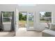 Sunroom featuring double doors to outside and ample natural light at 131 Autumn Ct, St Cloud, FL 34771