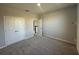 Spacious bedroom with neutral carpet and paint, featuring double door closet at 1360 Twelve Oaks Rd, St Cloud, FL 34771