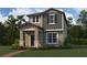 Rendering of a two-story home with neutral siding and landscaping in a lush green setting at 1360 Twelve Oaks Rd, St Cloud, FL 34771