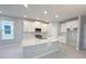 Modern kitchen with white cabinetry, granite countertops, stainless appliances, and center island sink at 1360 Twelve Oaks Rd, St Cloud, FL 34771