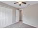 Bedroom featuring a closet, ceiling fan, and carpeted flooring at 14066 Sw 60Th Ter, Ocala, FL 34473