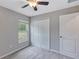 Carpeted bedroom featuring a window with blinds and a closet at 14066 Sw 60Th Ter, Ocala, FL 34473