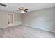 This bedroom has new carpet, neutral paint, a ceiling fan, and an ensuite at 14066 Sw 60Th Ter, Ocala, FL 34473