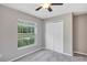 Bedroom featuring a window with blinds and a double-door closet at 14066 Sw 60Th Ter, Ocala, FL 34473