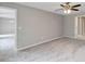 This bedroom has neutral walls, new carpet, a ceiling fan and an ensuite at 14066 Sw 60Th Ter, Ocala, FL 34473