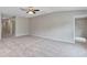 Large flexible room with neutral paint, new carpet and a ceiling fan at 14066 Sw 60Th Ter, Ocala, FL 34473