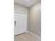 Foyer with tile flooring and a white front door with a digital lock at 14066 Sw 60Th Ter, Ocala, FL 34473