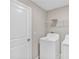 Functional laundry area with a modern washing machine, dryer, and convenient overhead shelving at 14066 Sw 60Th Ter, Ocala, FL 34473