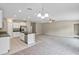 Spacious open-concept layout with a modern kitchen, comfortable carpeting, and a warm, inviting atmosphere at 14066 Sw 60Th Ter, Ocala, FL 34473