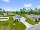 Charming single Gathering home with well-manicured lawn and attached garage, surrounded by green landscape at 149 Hickory Course Cir, Ocala, FL 34472